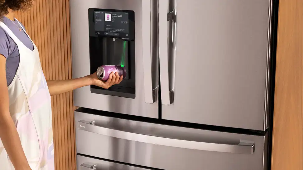Person scans a barcode from a home refrigerator