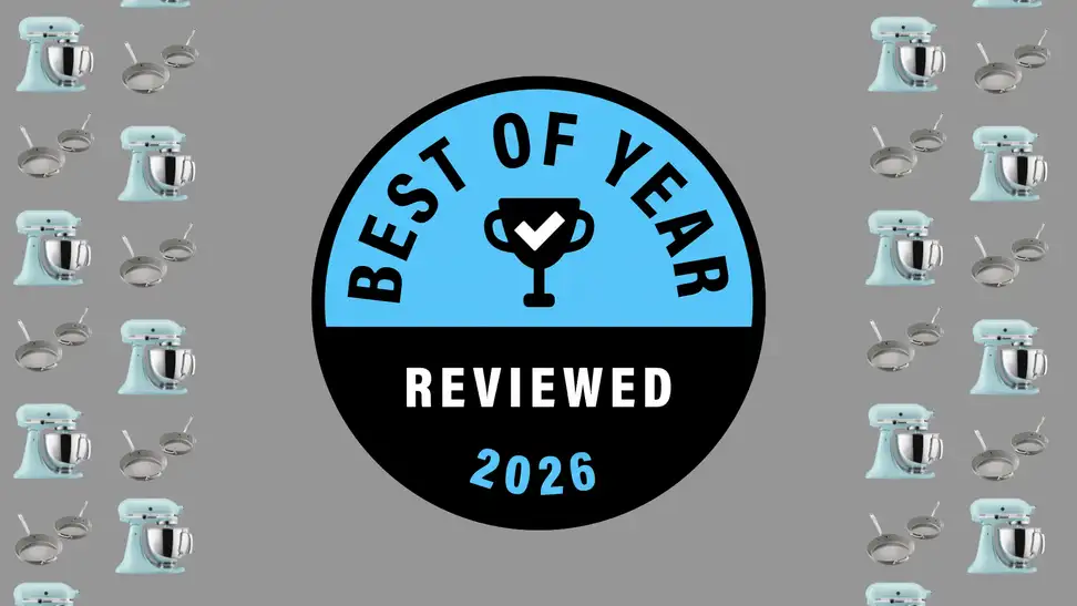 Reviewed's Best of Year Award badge on a gray background with pans and stand mixers