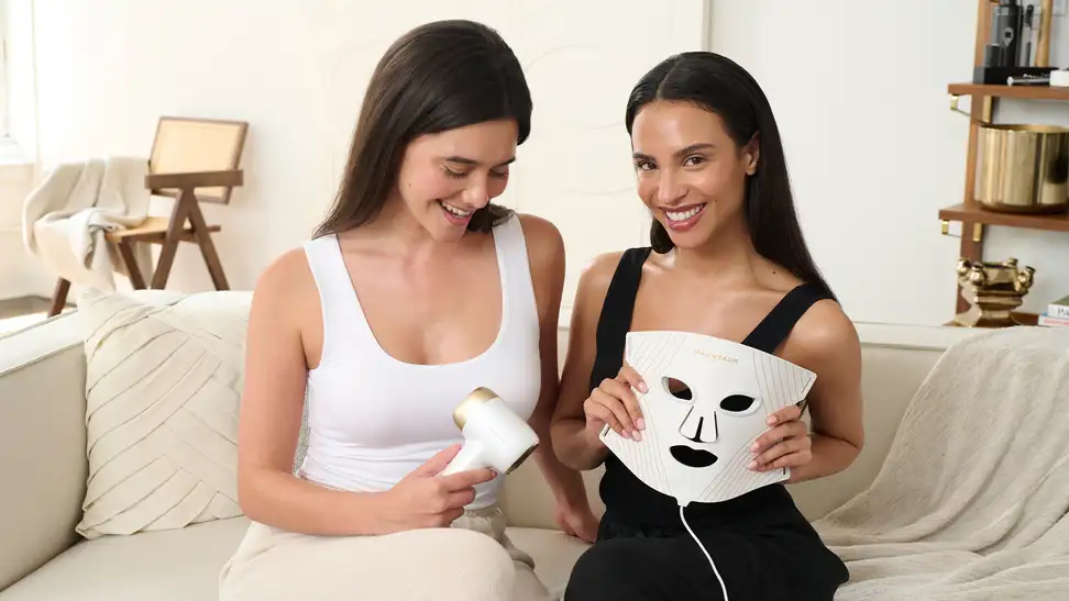 Two women using the WavyTalk Glow Time LED Therapy Mask and Bare It IPL Hair Remover