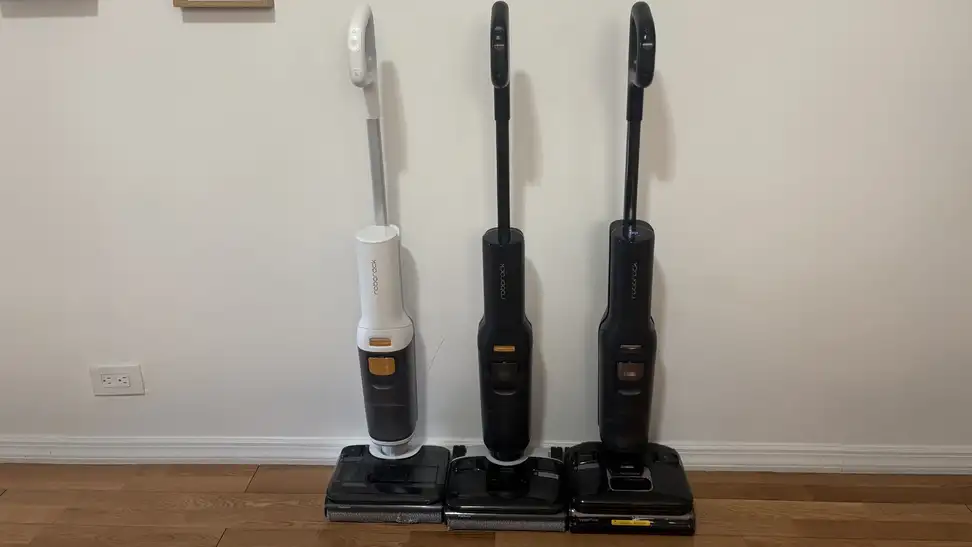 Roborock F25 Series Wet-Dry Vacuums stand against a wall in a residential hallway