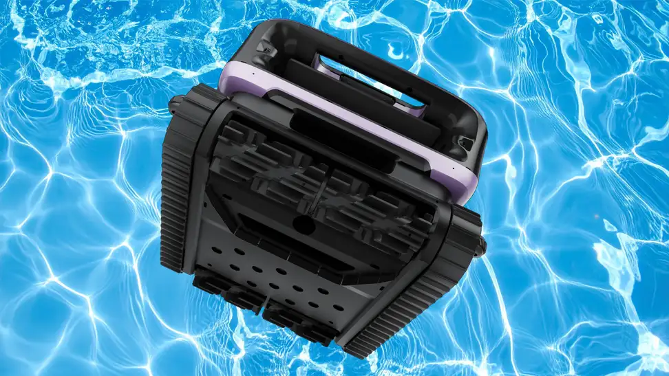 A pool robot vacuum floats in crystal clear pool water