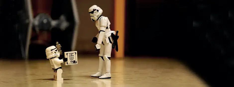 Storm Trooper kid is giving Storm Trooper dad the droid he has always been looking for.