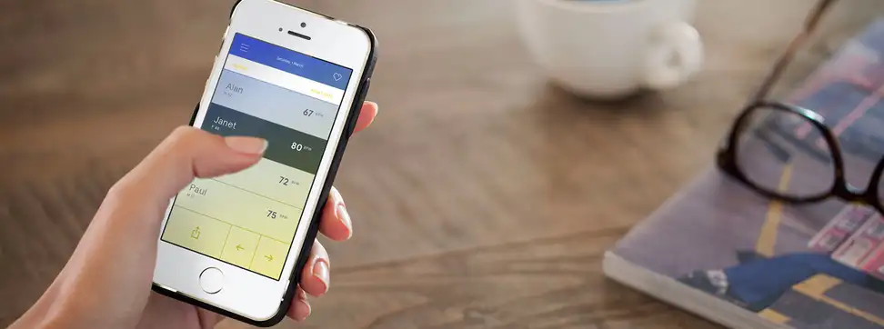 A hand operating the Wello app.