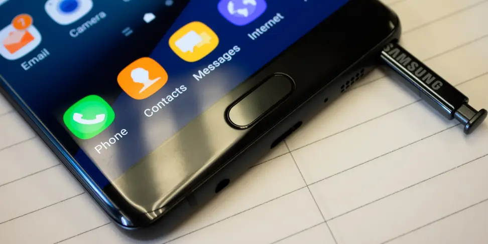 Close-up of a Samsung smartphone with a colorful touchscreen.