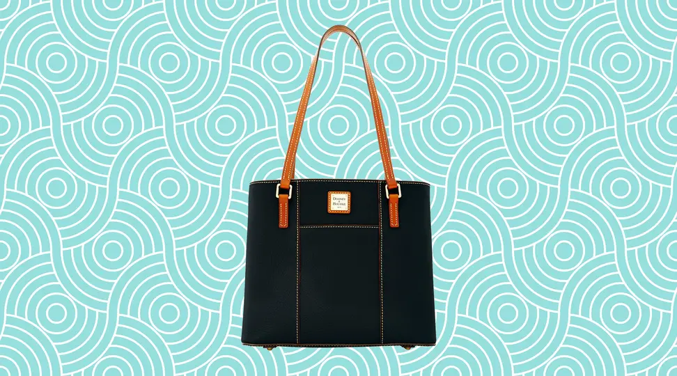 A leather Dooney & Bourke bag on a vibrant teal background.