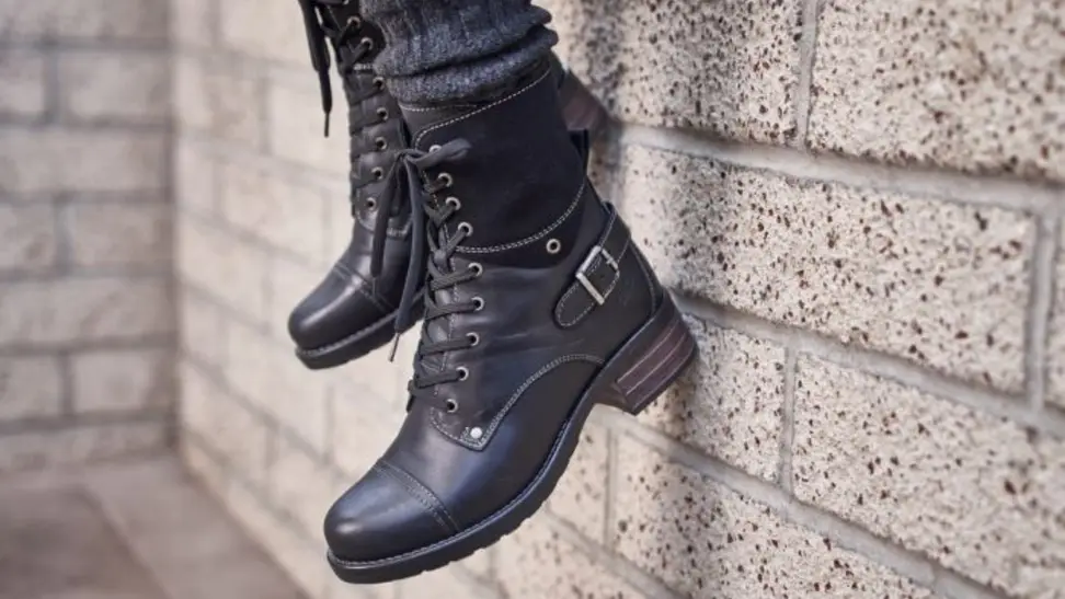Crave boots from Taos dangling from a wall