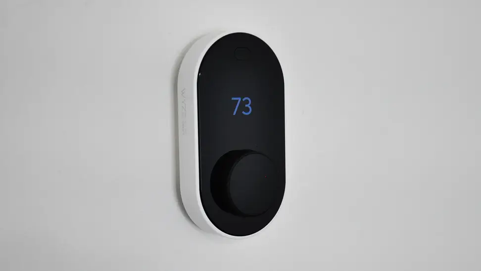 Wyze Thermostat against white wall