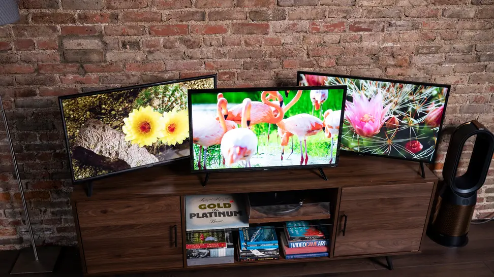 A trio of 32-inch TVs on a table