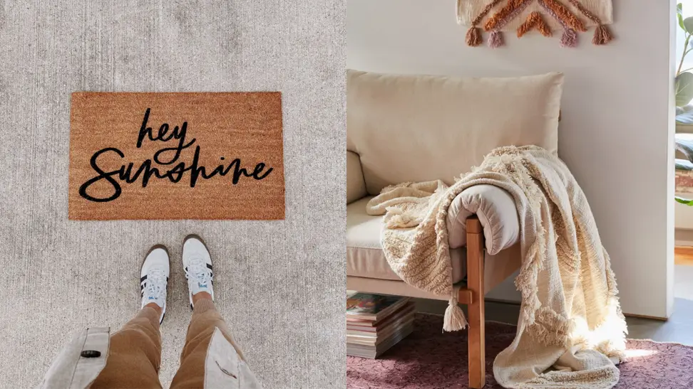 Doormat with the words "hey sunshine" and throw blanket hanging over a chair.