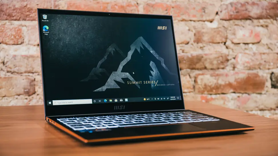 The laptop sits on a table, open