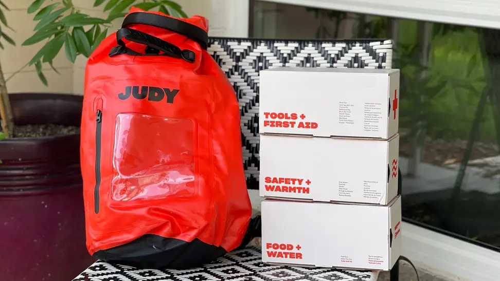 The Judy Mover Max Kit sits on a black and white chair outdoors.