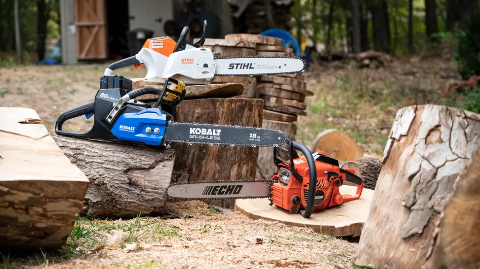 Several chainsaws displayed outdoors.