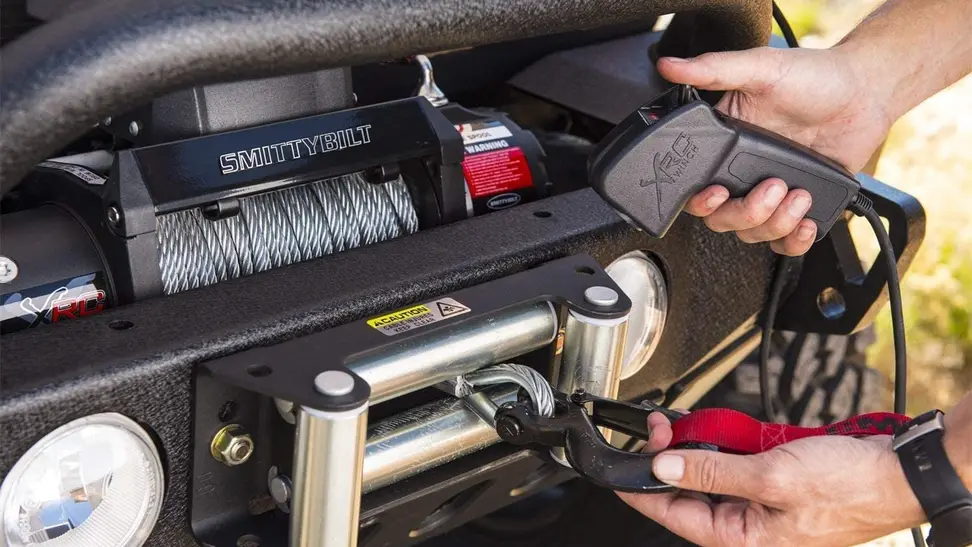 Close-up of a Smittybilt winch.