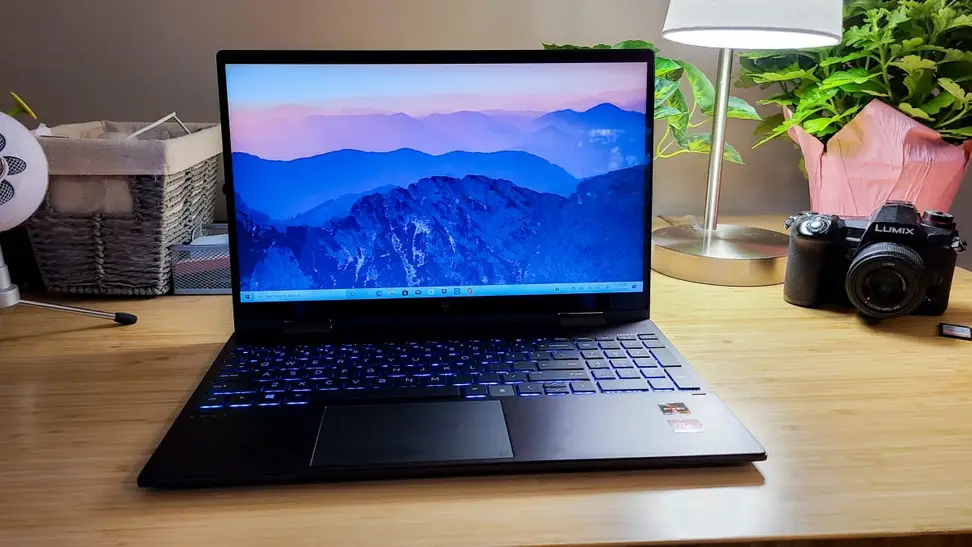 Photo of the HP Envy x360 laptop on a desk.