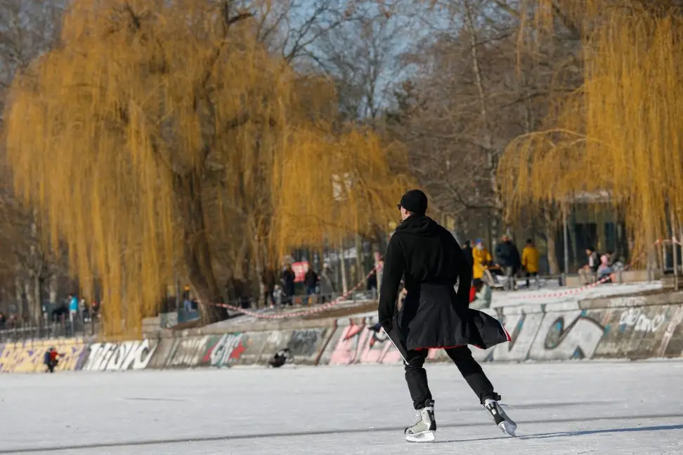 Photo of a person ice skating in the park.