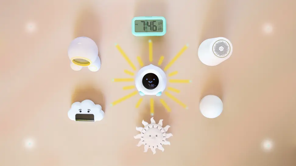 A selection of 9 alarm clocks for kids on a tan background.