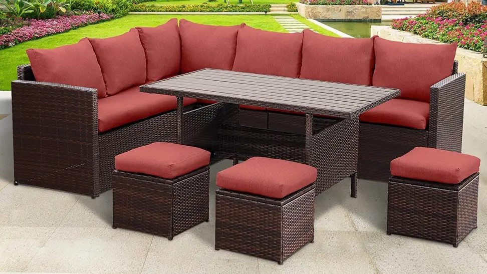 A 7-piece outdoor dining set placed on the back patio of someone's home.