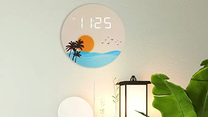 Digital wall clock showing ocean images hanging on wall