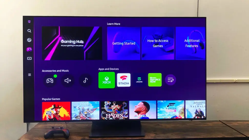 A 55-inch Samsung S95B OLED TV displaying the home screen of Samsung's Gaming Hub platform