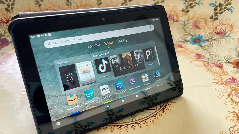 The Amazon Fire 7 tablet with the home menu displayed on the screen.
