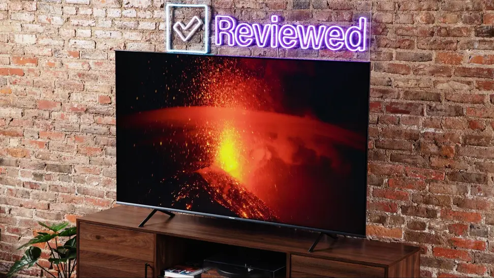 A television screen showing a bright scene on display in a living room.