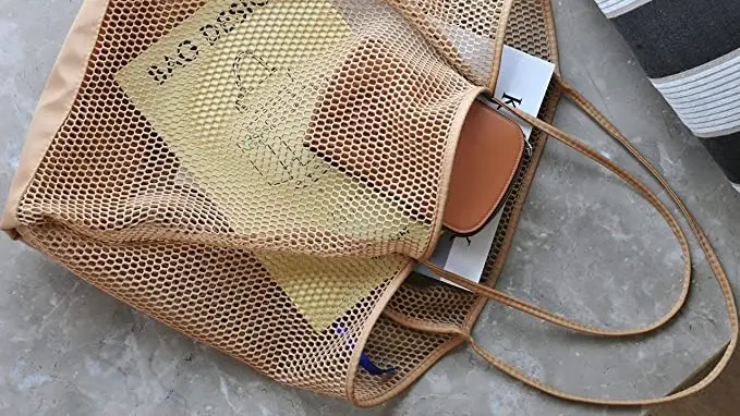 A beach bag being used to store items for a beach trip.