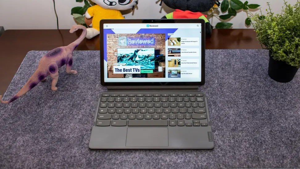 The Lenovo IdeaPad Chromebook Duet 3 and keyboard setup like a laptop, the display featuring the Reviewed website homepage.