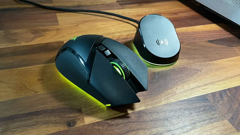 The Razer Basilisk V3 Pro mouse with yellow LED lights underneath.