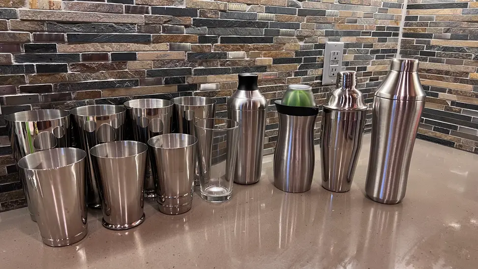 A large selection of cocktail shakers waiting to be tested
