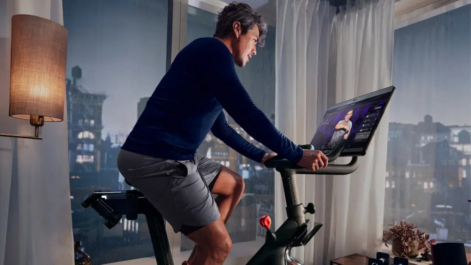 A man riding a Peloton Bike.