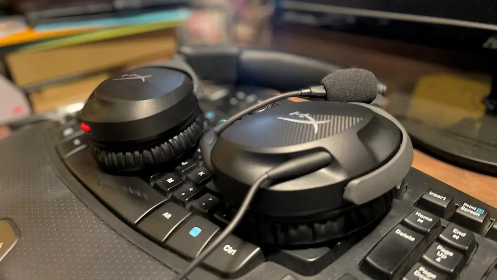 The HyperX Cloud Stinger sitting atop a keyboard.