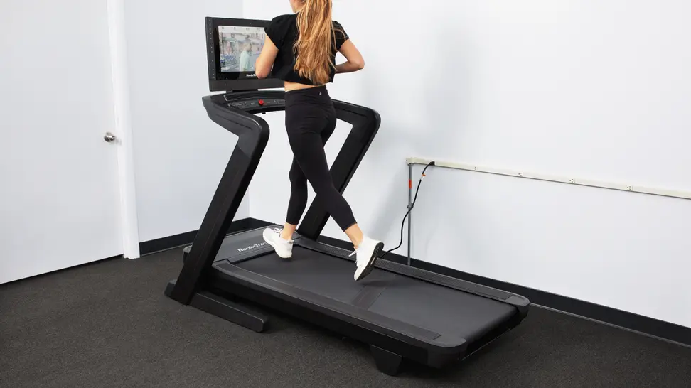 A person jogging atop the NordicTrack Commercial 2450.