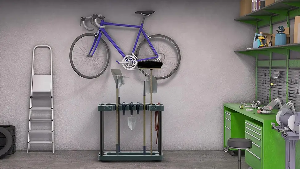 Garden tools and a bike hanging from an organizer.