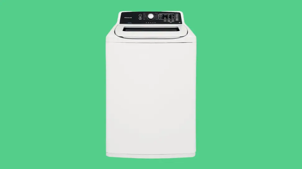 The Frigidaire FFTW4120SW top-load washing machine sits on a green background