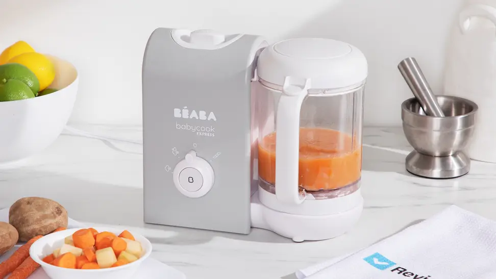 A gray and white Beaba Babycook Express sitting on a kitchen counter.