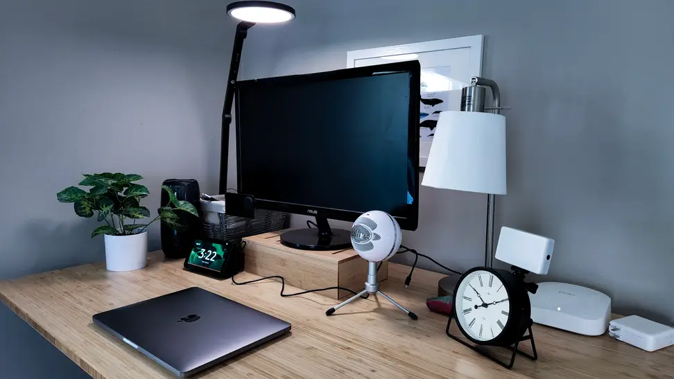 A desk lit by an LED lamp from Lume Cube