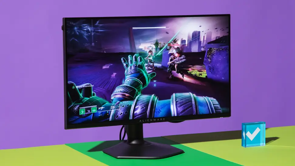 The Alienware AW2523HF gaming monitor on top of green and yellow surface in front of purple wall with display featuring interactive video game on screen.