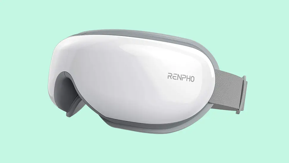 A Renpho eye massager on a light green background.