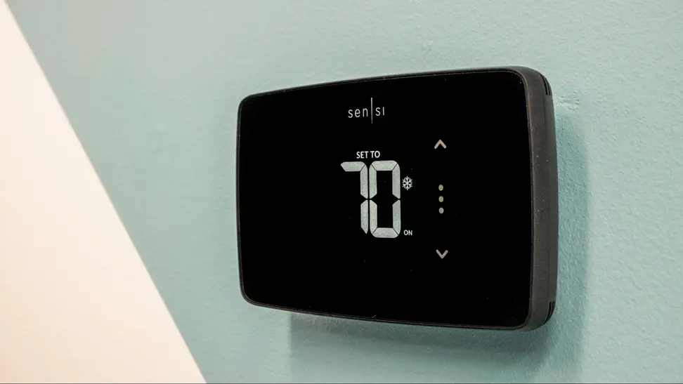 The Sensi Lite appears on a seafoam and gray background.