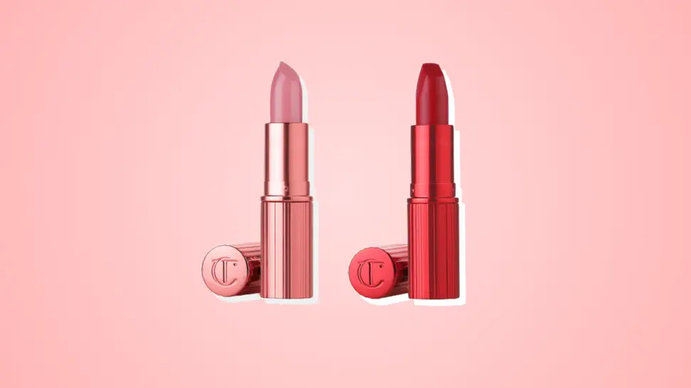 Two Charlotte Tilbury Hollywood Icon Beauty lipsticks in pink and red against a pink background.