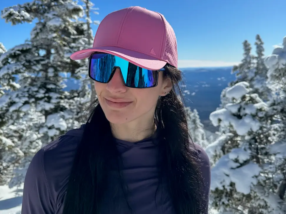 Staff Writer Lily Hartman wearing her Oakley Sutros on a winter hike.