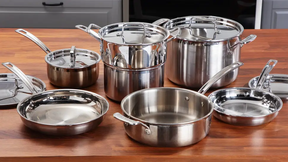 12-piece Cuisinart stainless steel cookware set on a wooden surface