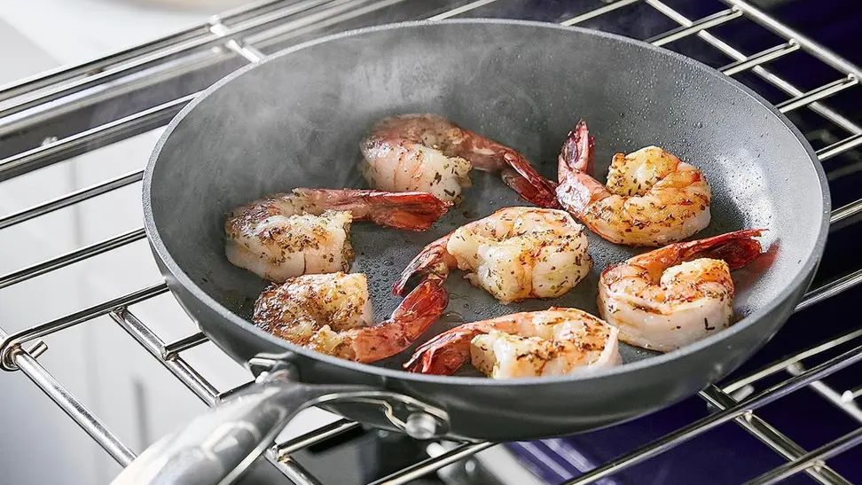 A piece of cookware from GreenPan frying shrimp.