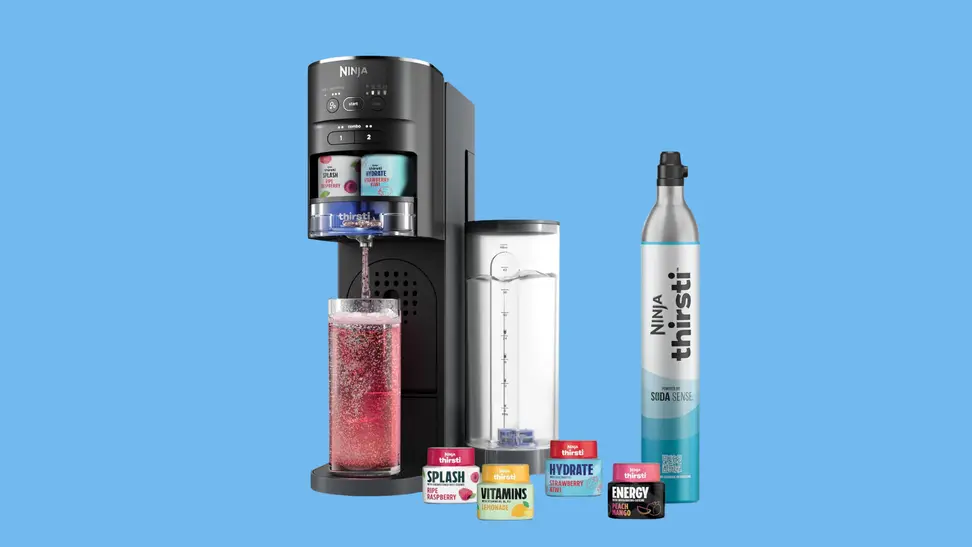 The Ninja Thirsti with supplements, a bottle, and a cup being brewed on.