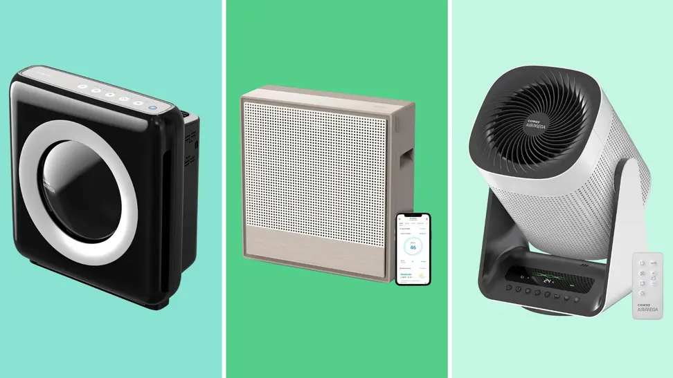 Three air purifiers on a green background