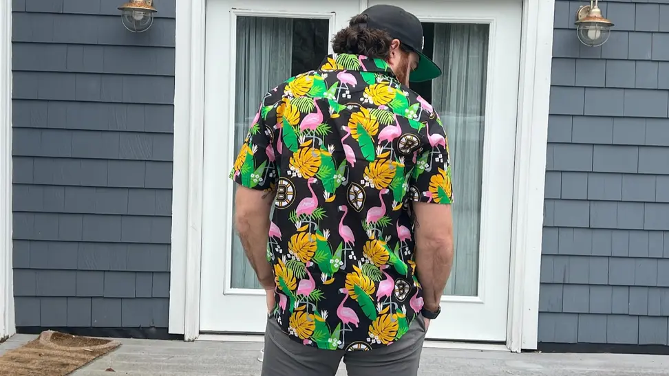 Man wearing a Bruins shirt.