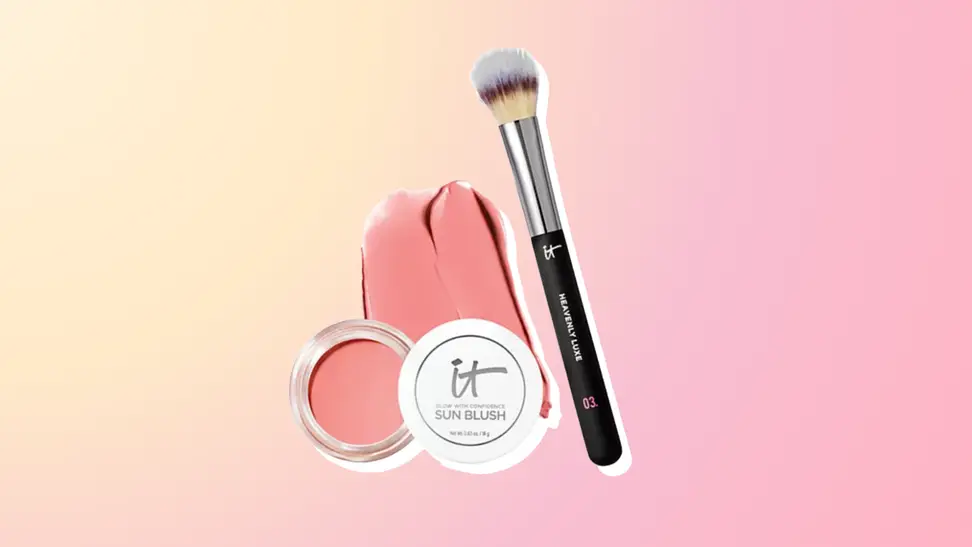 IT Cosmetics Sun Blush and brush against a pink and orange background.