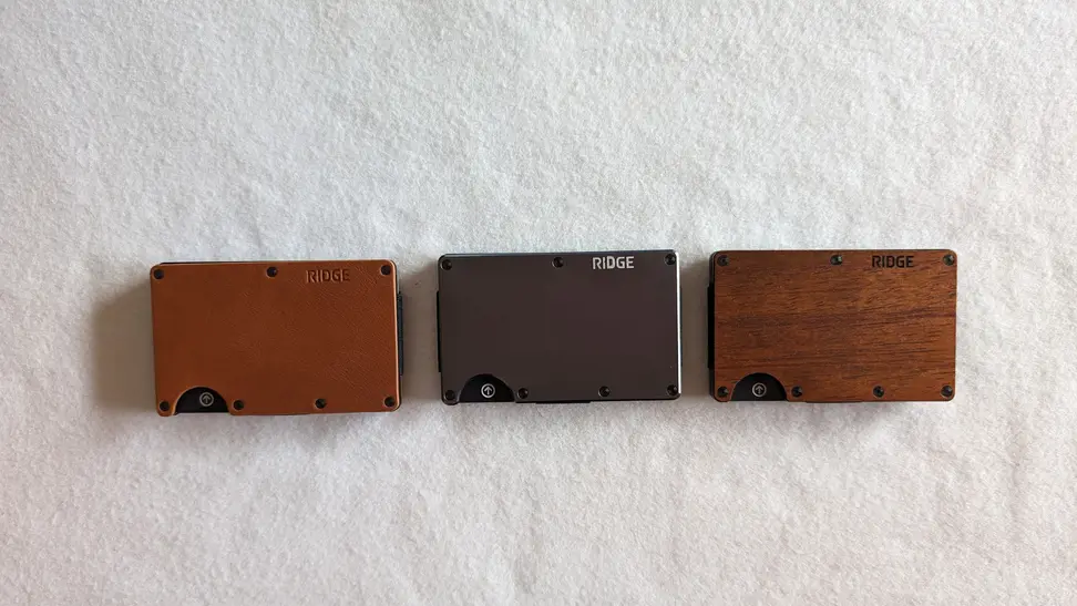 Three wallets against a white background.