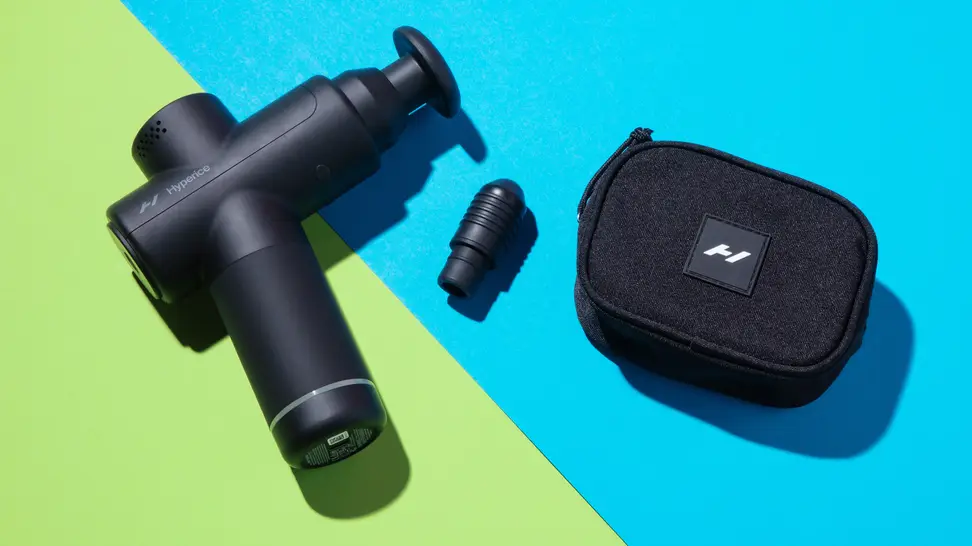 The Hyperice Hypervolt 2 Go on a green and blue background.
