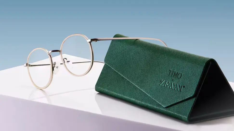 pair of glasses and case on white platform